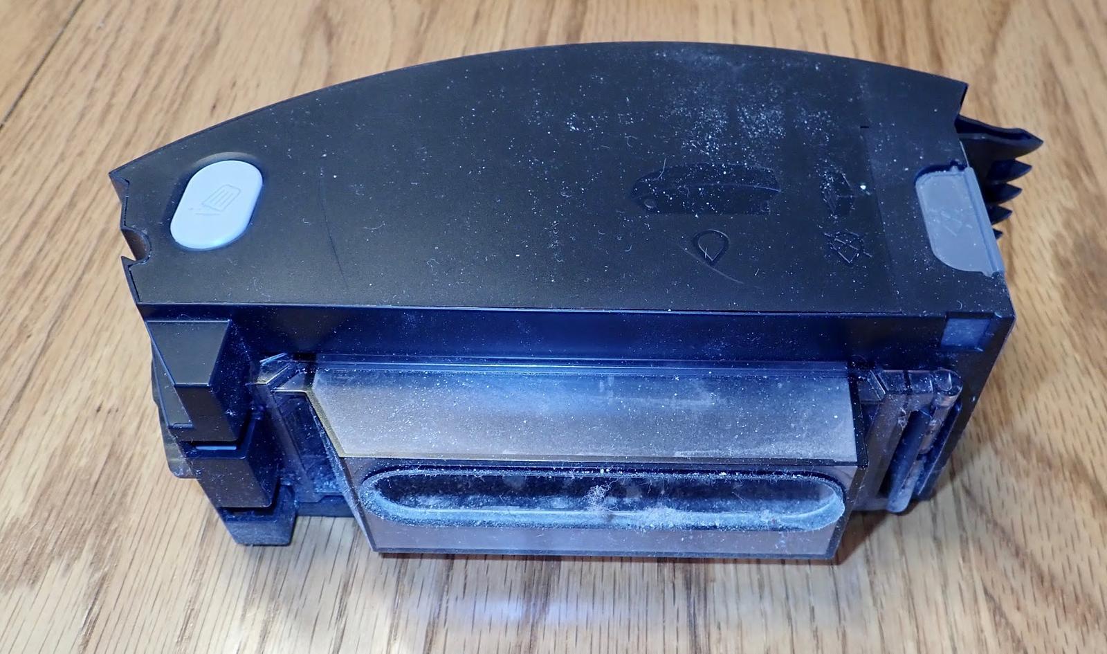 Roomba i7 Teardown: Why is there a waving cat with a lint roller inside?