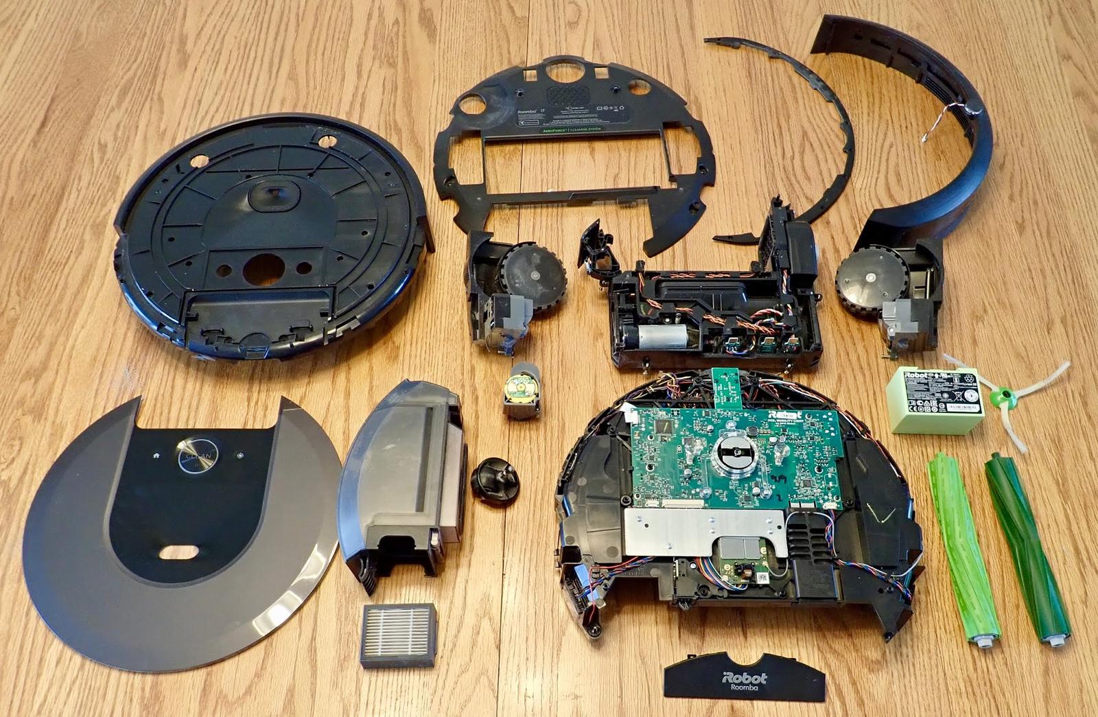 Roomba i7 Teardown: Why there a waving cat with a lint roller inside?